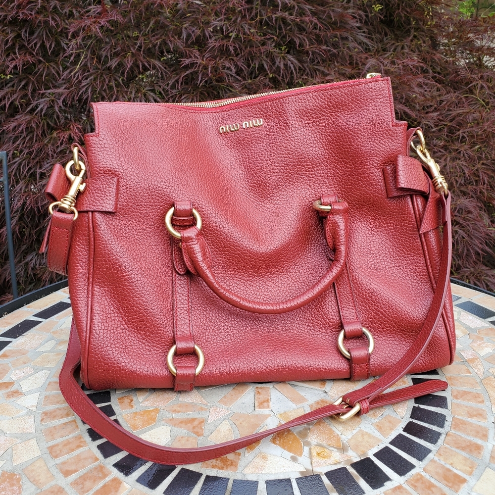 Miu Miu dark red leather bow bag.